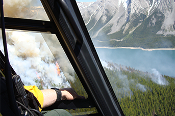 Helicopter CharterAdvanced Helicopter Forestry Proficiency Pilot Training Calgary Alberta Canada - Man in a helicopter