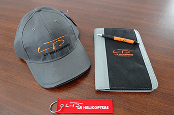 L R Helicopters branded cap, notebook and keyring