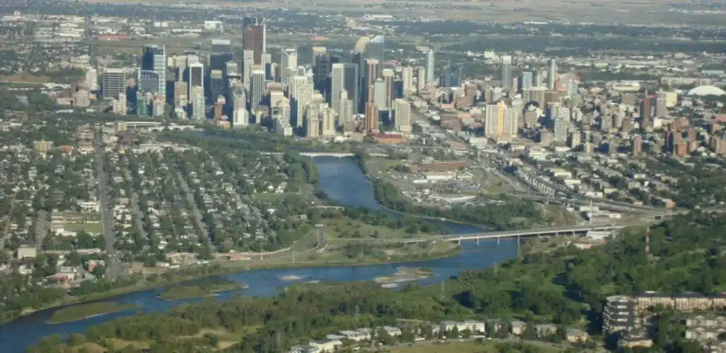 Aerial view of downtown Calgary skyline and Bow River on a Calgary Helicopter Tour with L R Helicopters from Springbank Airport