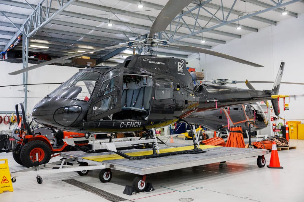 Airbus-AS350B3+DH BLR helicopter C-FNCH in LR Helicopters livery on waterfront helipad — helicopter fleet Calgary Alberta Springbank Airport